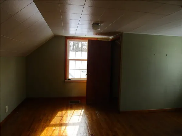 a view of an empty room and window
