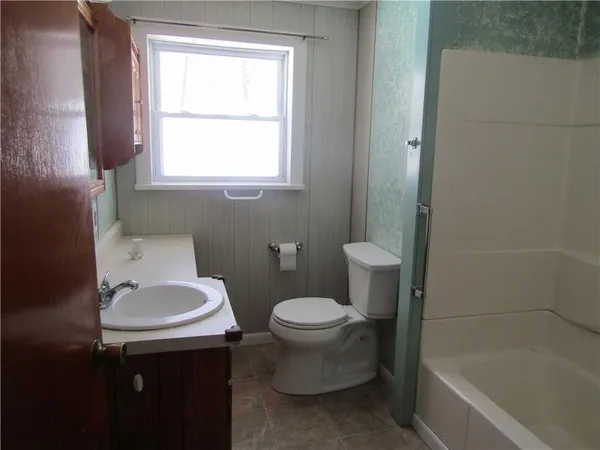 a bathroom with a sink toilet and a bathtub