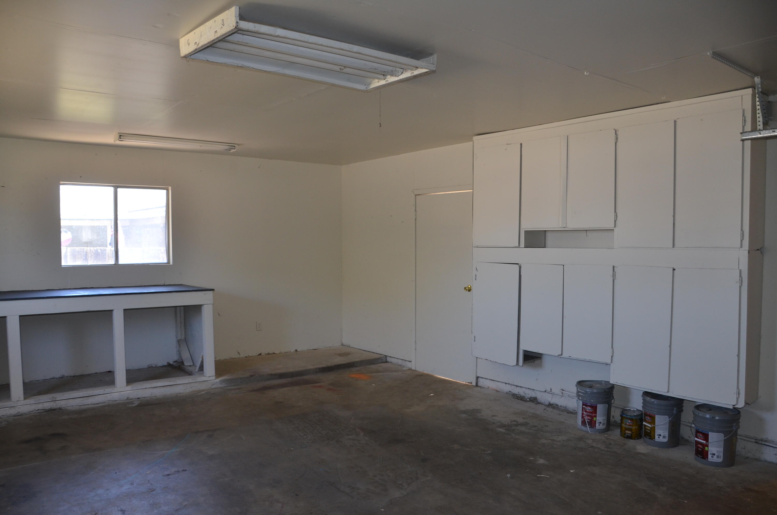 339 West Spring Lane Lemoore, CA 93245 - Photo 14 of 31 a view of a livingroom with an empty space and a window