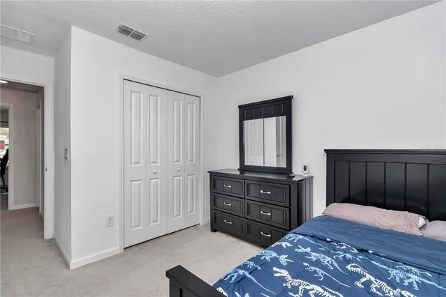 a room with a dresser and a dresser