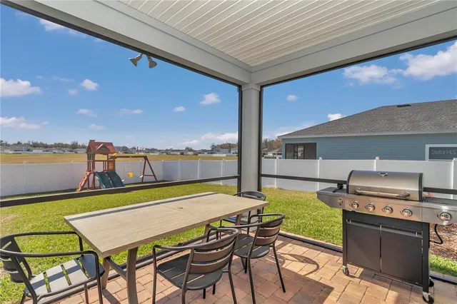 a view of a chairs and table in the patio