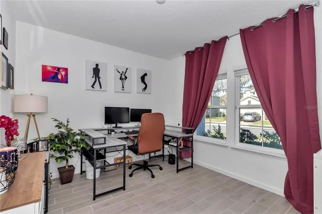 a workspace with furniture and a potted plant