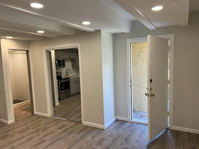 a view of entryway with wooden floor