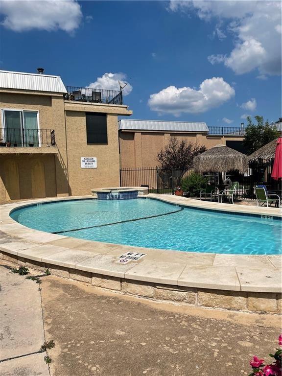 5804 Circulo Drive, Unit 5E Lago Vista, TX 78645 - Photo 10 of 12 a view of a house with a yard