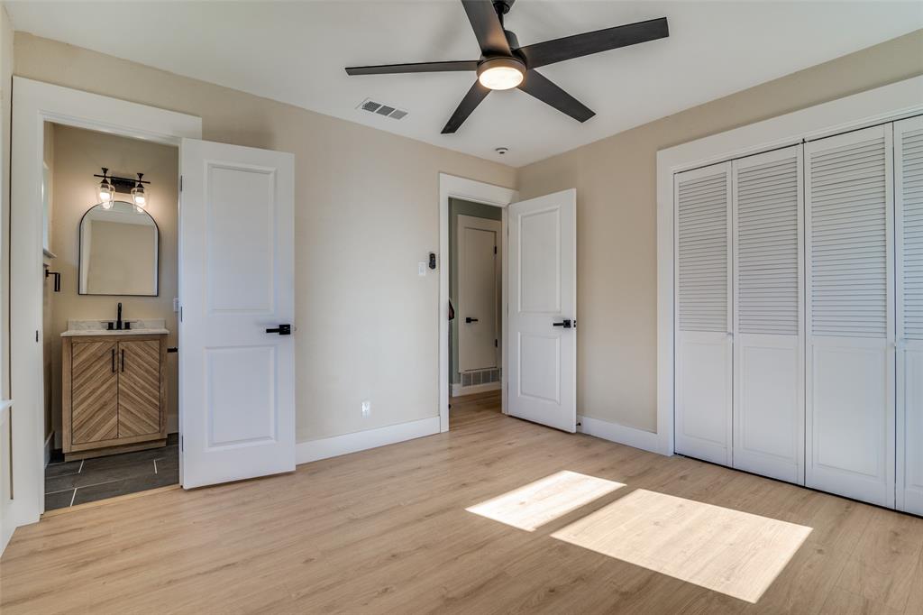 9209 Rustown Drive Dallas, TX 75228 - Photo 14 of 28 wooden floor in an empty room with a window