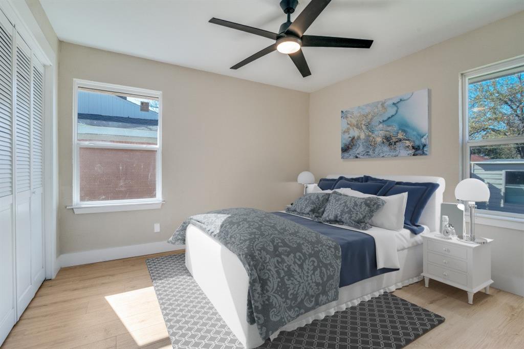 9209 Rustown Drive Dallas, TX 75228 - Photo 17 of 28 a bedroom with a large bed and a window
