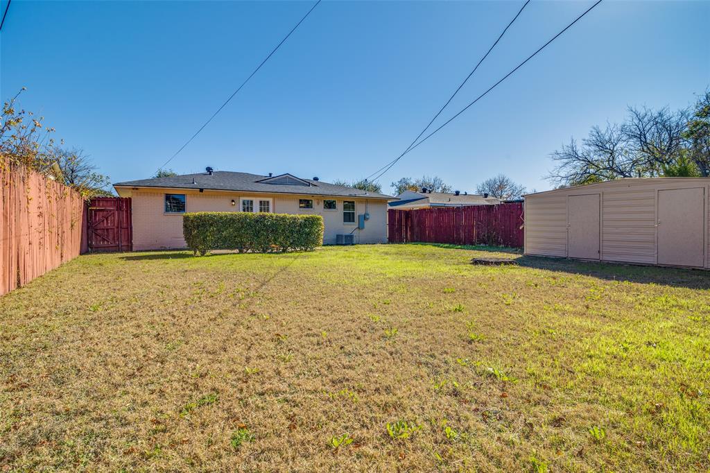 9209 Rustown Drive Dallas, TX 75228 - Photo 27 of 28 a view of a house with a yard