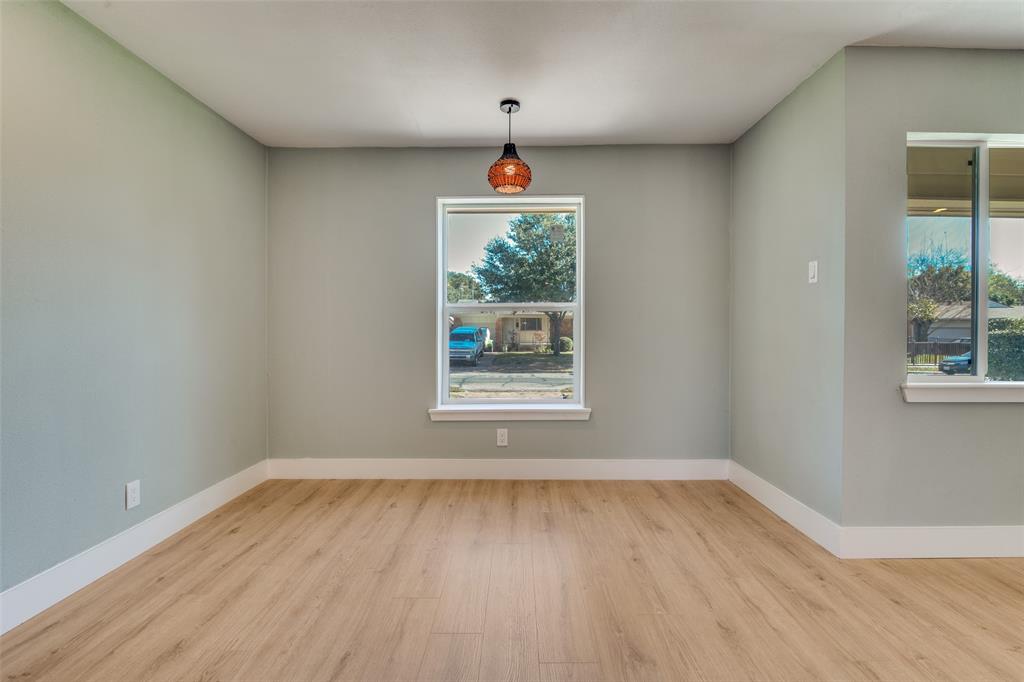 9209 Rustown Drive Dallas, TX 75228 - Photo 6 of 28 a front view of a house with wooden floor