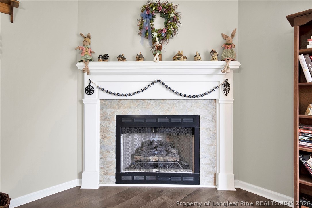 4425 Bishamon Street Hope Mills, NC 28348 - Photo 11 of 39 a fireplace with a vase on top of it
