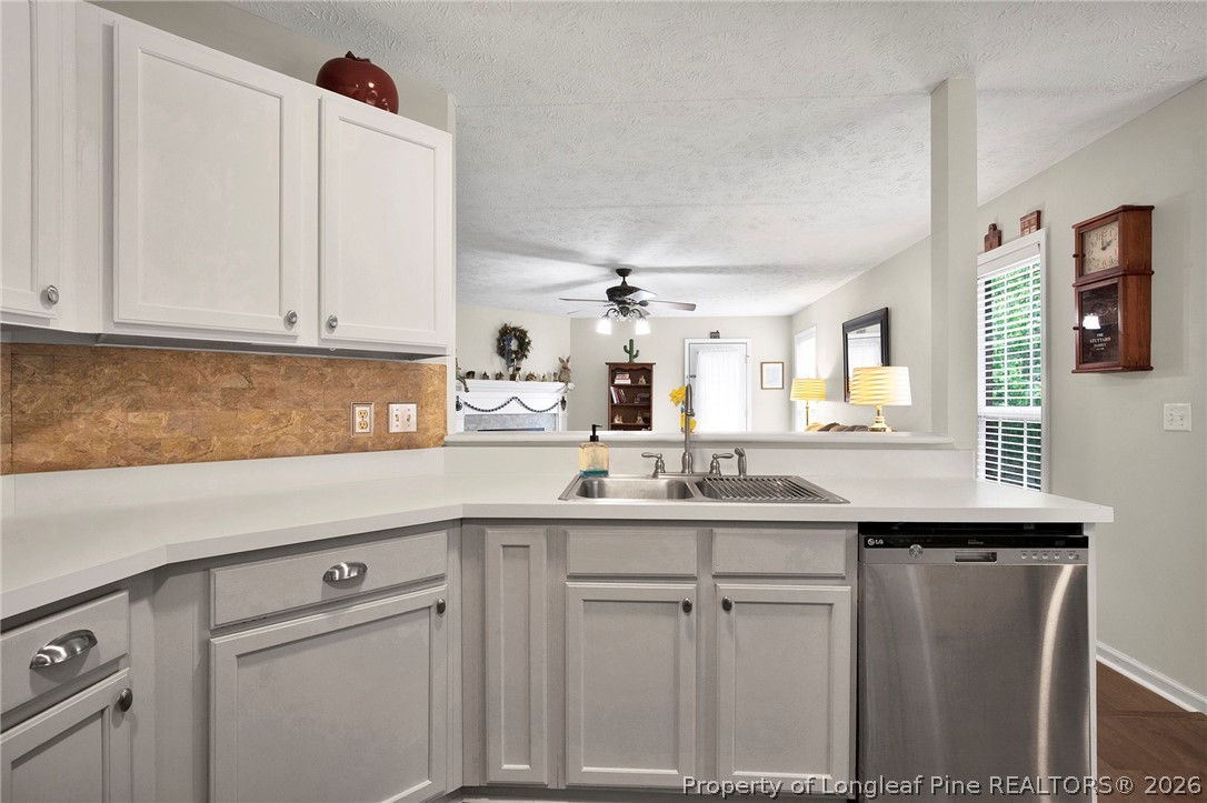 4425 Bishamon Street Hope Mills, NC 28348 - Photo 14 of 39 a kitchen with stainless steel appliances granite countertop a sink and cabinets