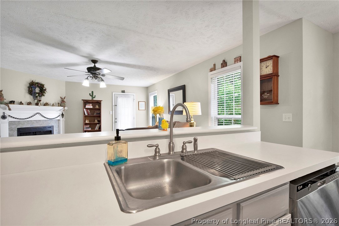 4425 Bishamon Street Hope Mills, NC 28348 - Photo 15 of 39 a kitchen with a sink and a refrigerator