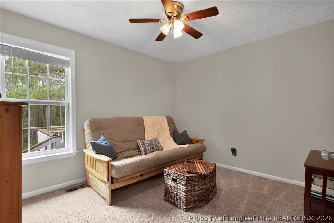 4425 Bishamon Street Hope Mills, NC 28348 - Photo 23 of 39 a living room with furniture and a window