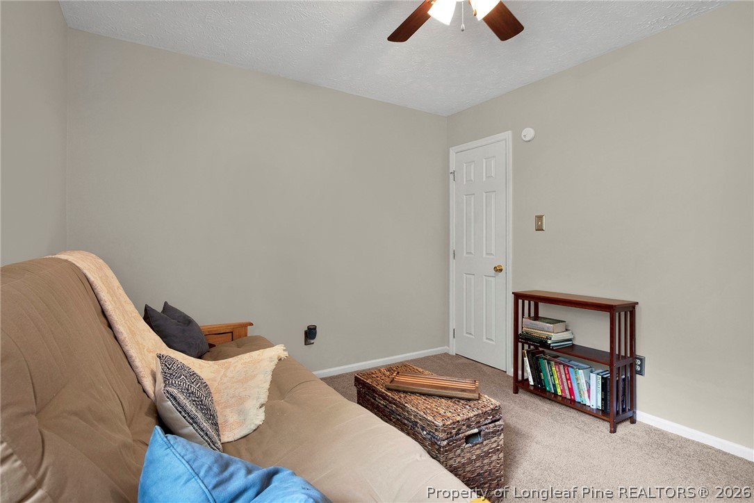 4425 Bishamon Street Hope Mills, NC 28348 - Photo 24 of 39 a bedroom with a bed and a book shelf