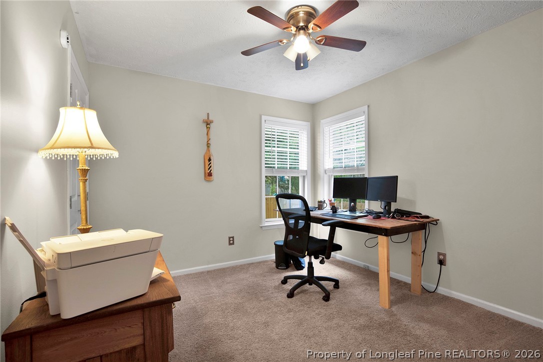 4425 Bishamon Street Hope Mills, NC 28348 - Photo 25 of 39 a view of a workspace with furniture and a window