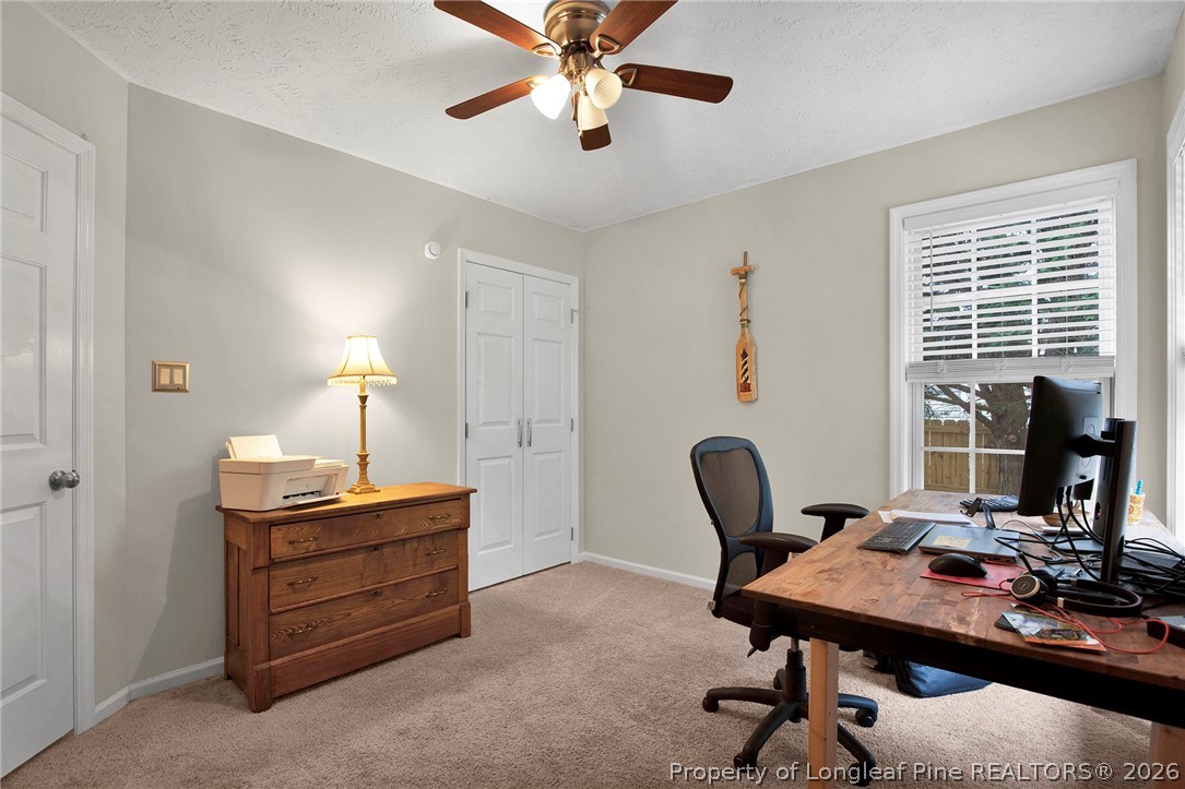 4425 Bishamon Street Hope Mills, NC 28348 - Photo 26 of 39 a view of a workspace with furniture and a window