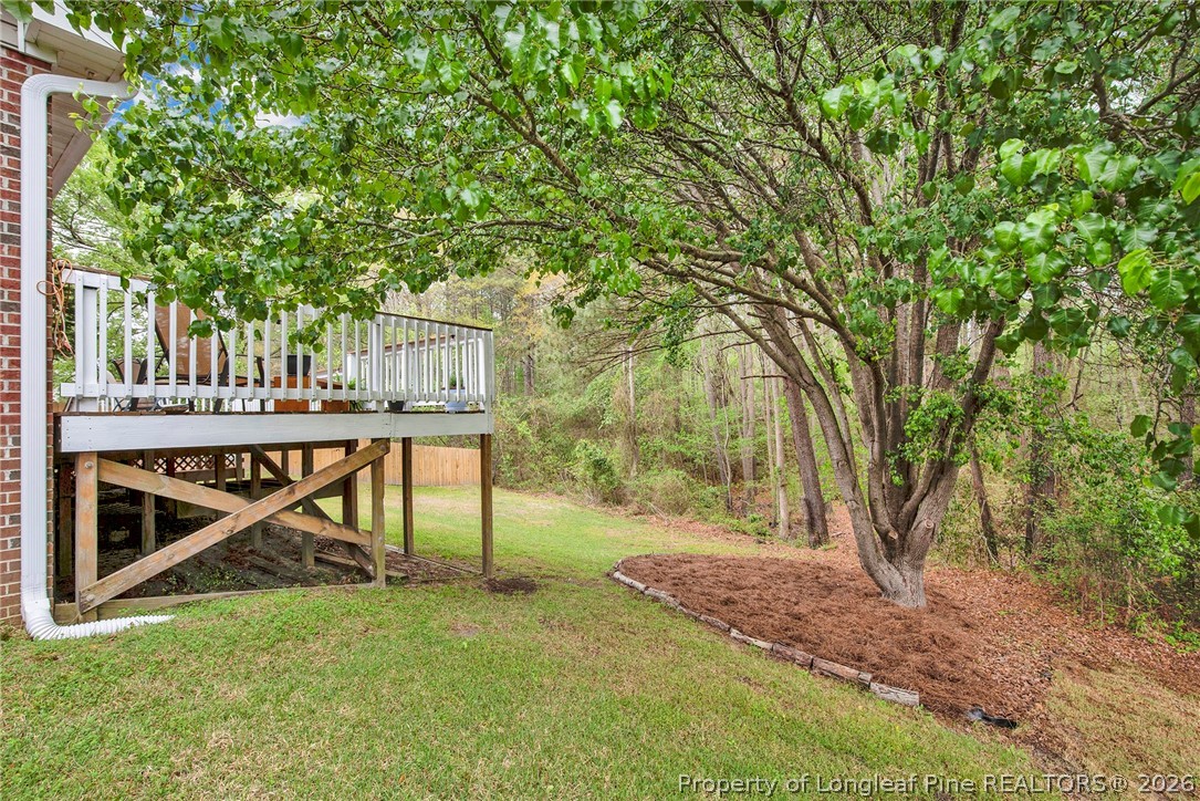 4425 Bishamon Street Hope Mills, NC 28348 - Photo 31 of 39 a view of house with backyard and trees