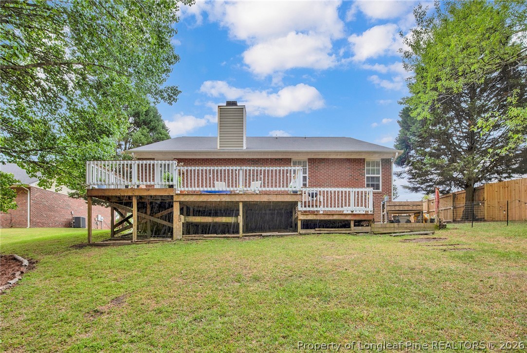 4425 Bishamon Street Hope Mills, NC 28348 - Photo 34 of 39 a view of a house with a yard and sitting area