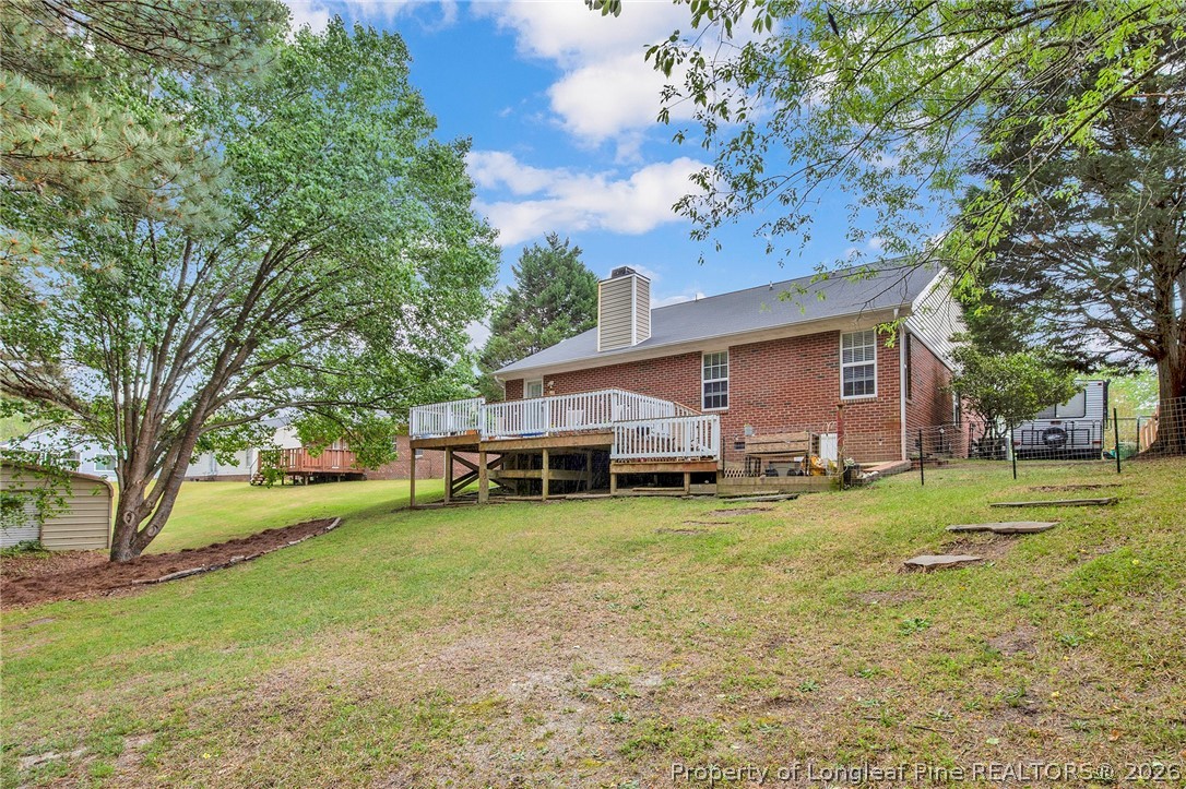 4425 Bishamon Street Hope Mills, NC 28348 - Photo 35 of 39 a view of a house with garden and trees