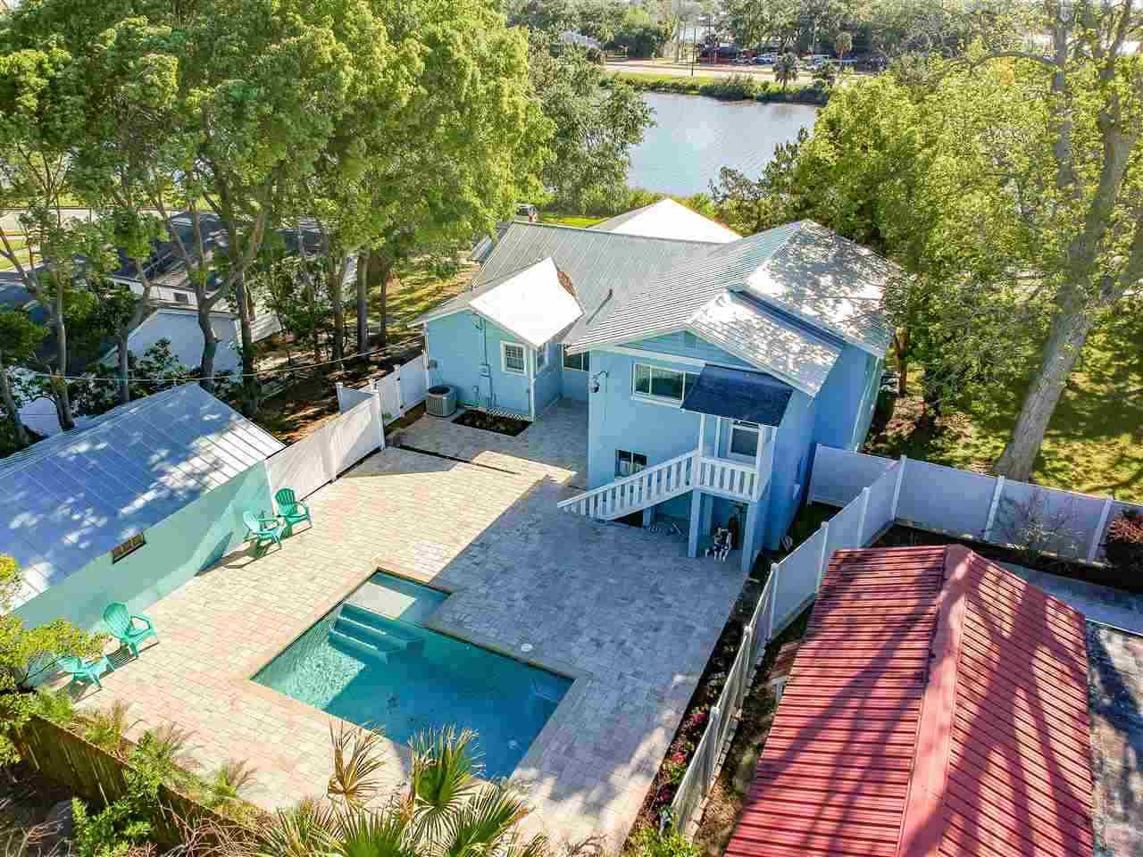 26 Rio Vista Drive St. Augustine, FL 32084 - Photo 1 of 91 a view of a house with pool and outdoor seating