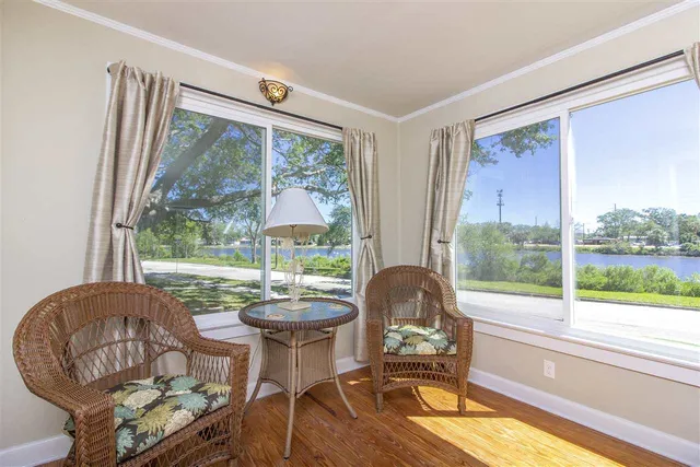 a bedroom with a bed dresser and a window