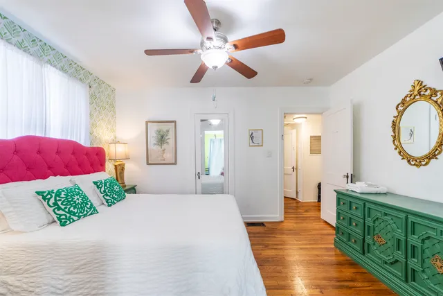 a bedroom with a large bed and a couch