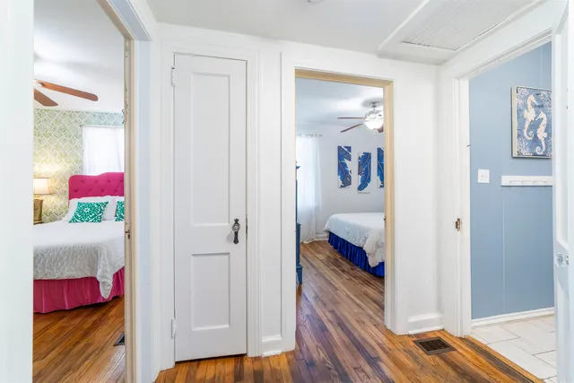 a living room with furniture and a lamp