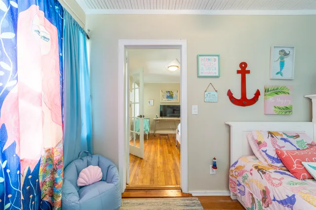 a view of a backyard with plants and a patio