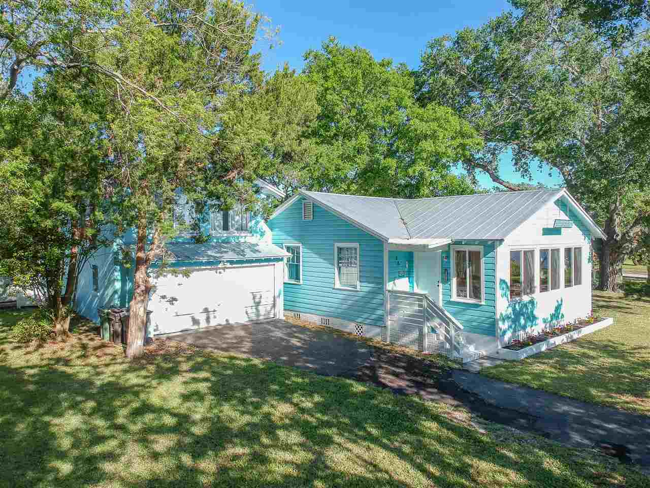 26 Rio Vista Drive St. Augustine, FL 32084 - Photo 4 of 91 a view of a house with a yard and potted plants