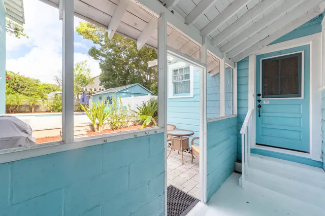 an aerial view of a house with a yard and garden