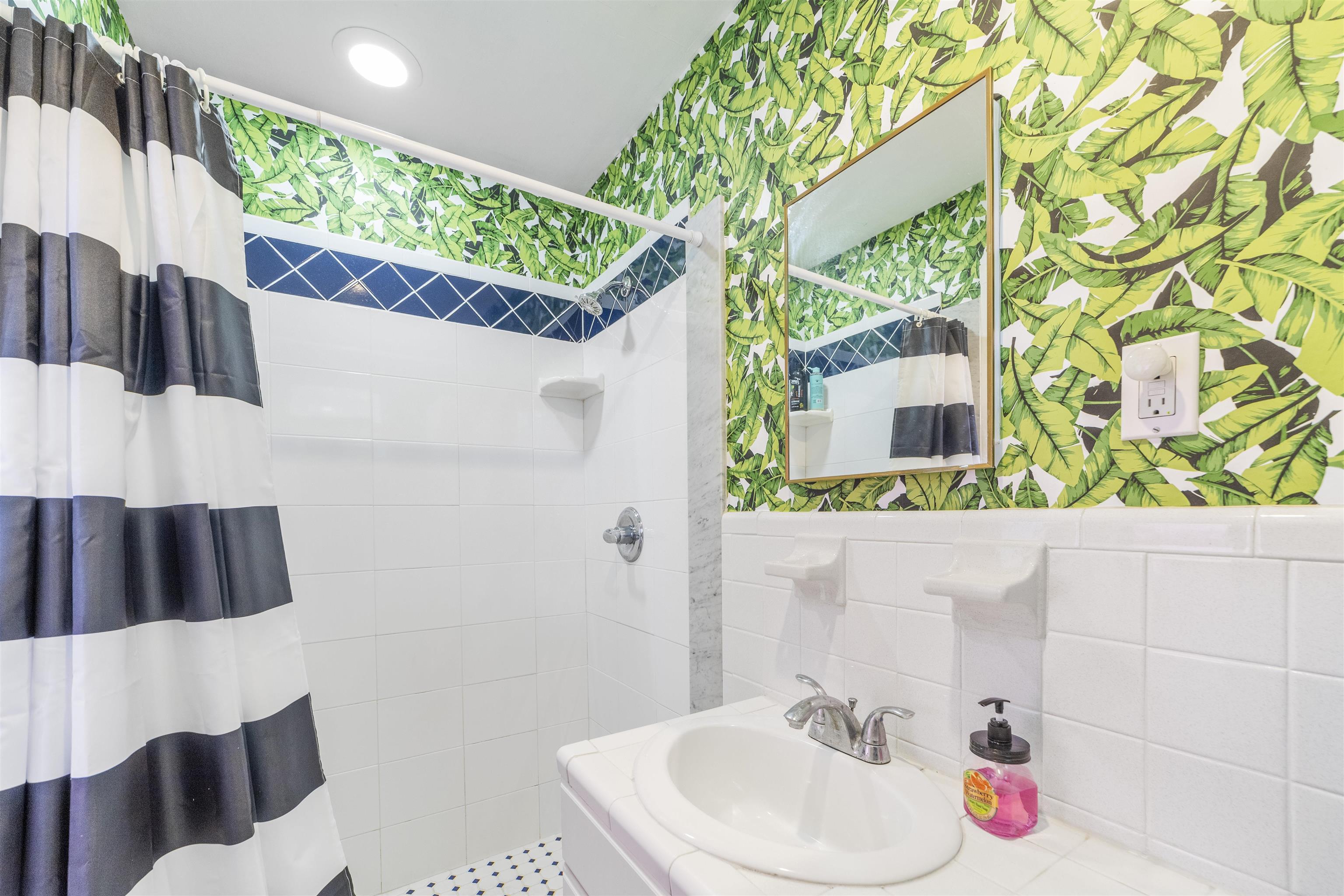 26 Rio Vista Drive St. Augustine, FL 32084 - Photo 59 of 91 a bathroom with a sink and a mirror