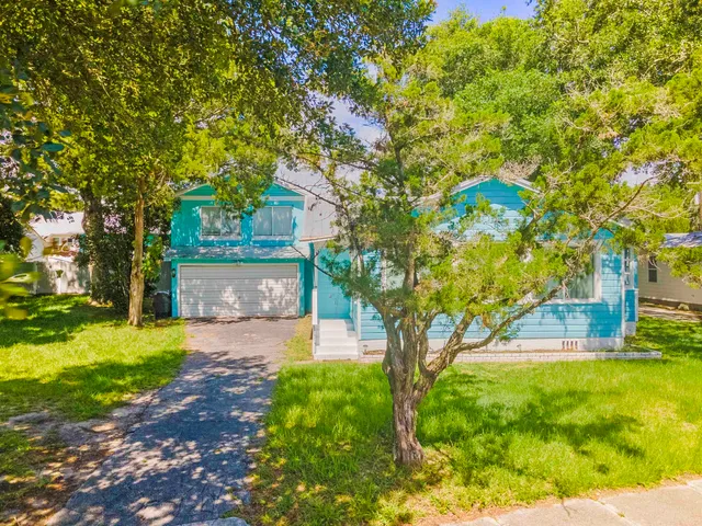 an aerial view of a houses with a lake view