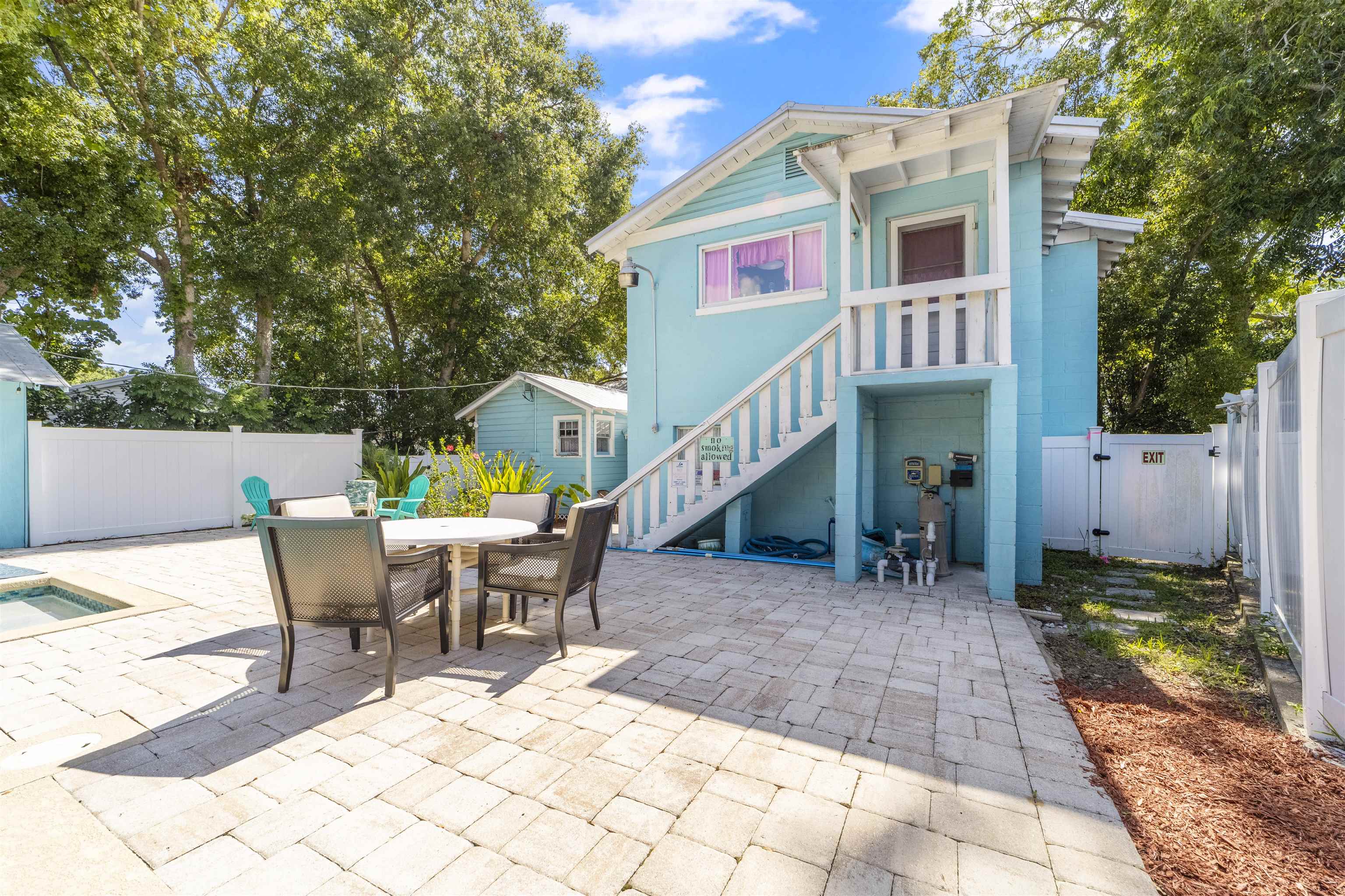 26 Rio Vista Drive St. Augustine, FL 32084 - Photo 73 of 91 a view of a patio with a table and chairs and wooden fence