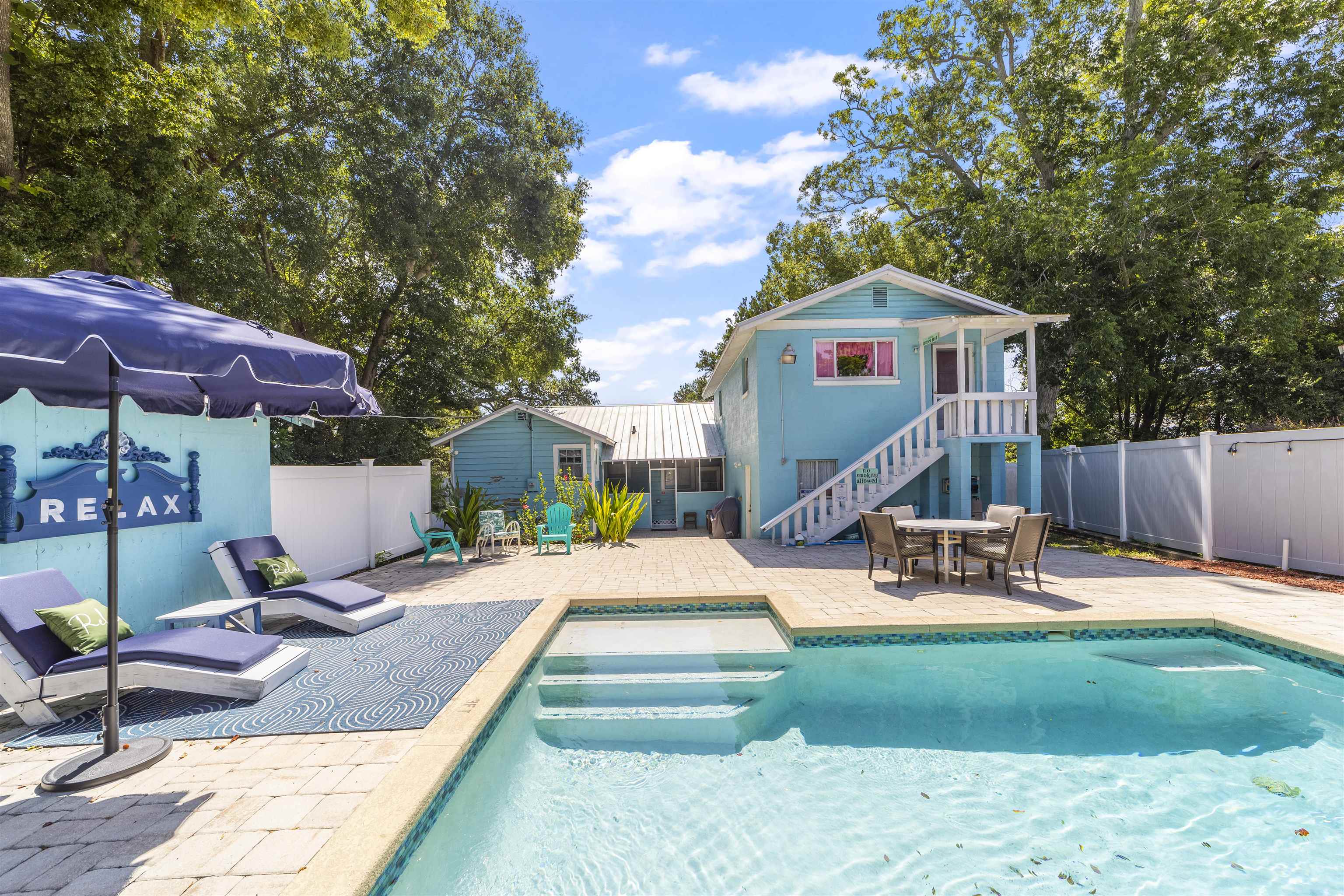 26 Rio Vista Drive St. Augustine, FL 32084 - Photo 74 of 91 a front view of a house with garden and sitting area