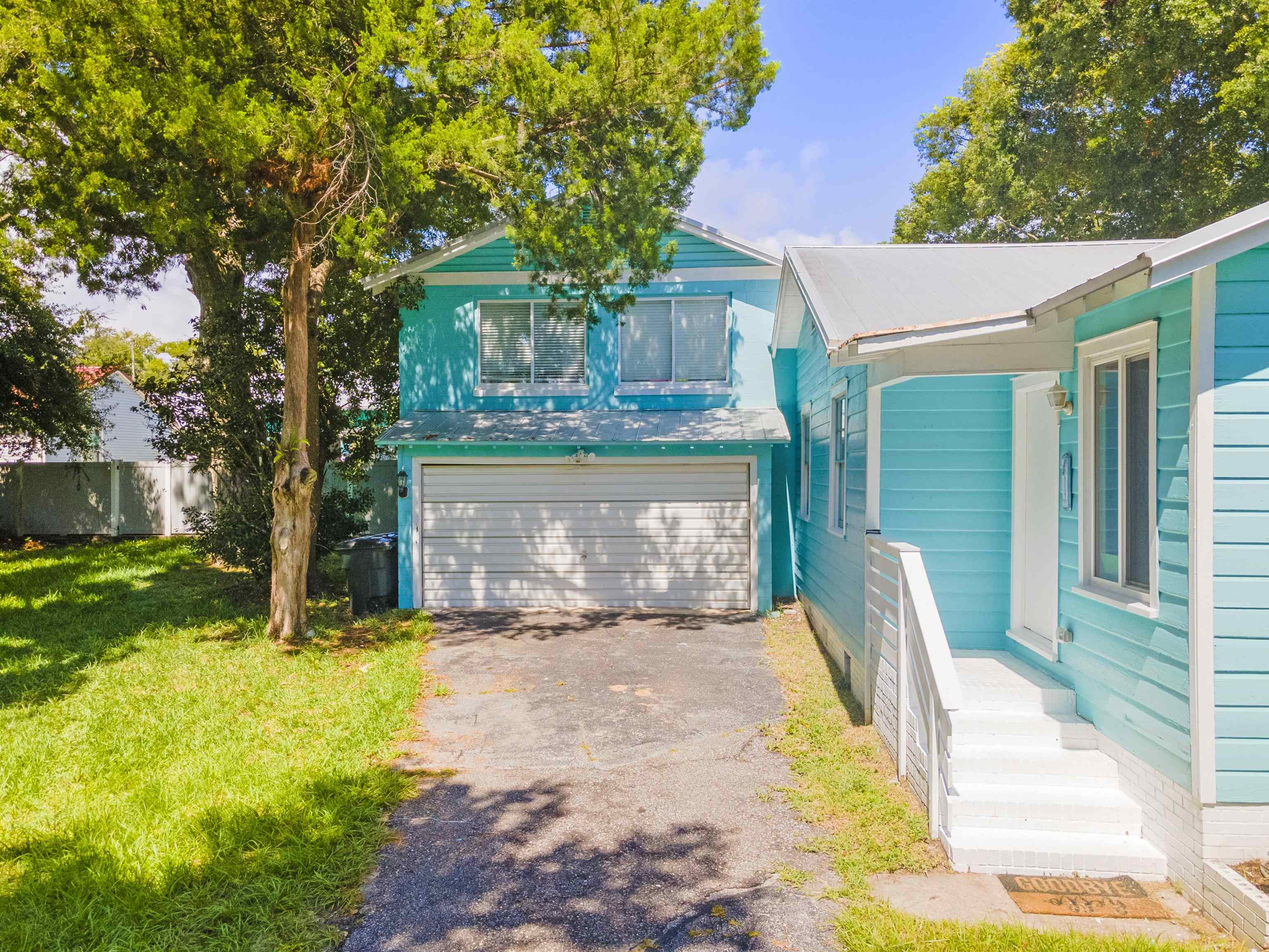 26 Rio Vista Drive St. Augustine, FL 32084 - Photo 9 of 91 a view of a house with backyard and a tree
