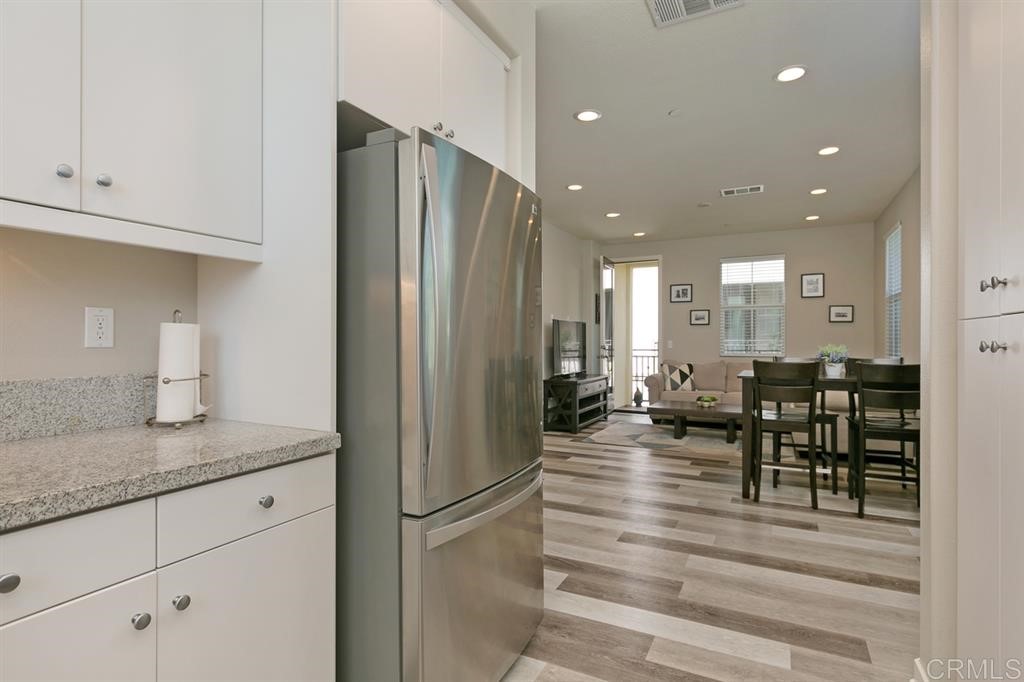 4222 Mission Ranch Way Oceanside, CA 92057 - Photo 11 of 22 a kitchen with stainless steel appliances granite countertop refrigerator and cabinets