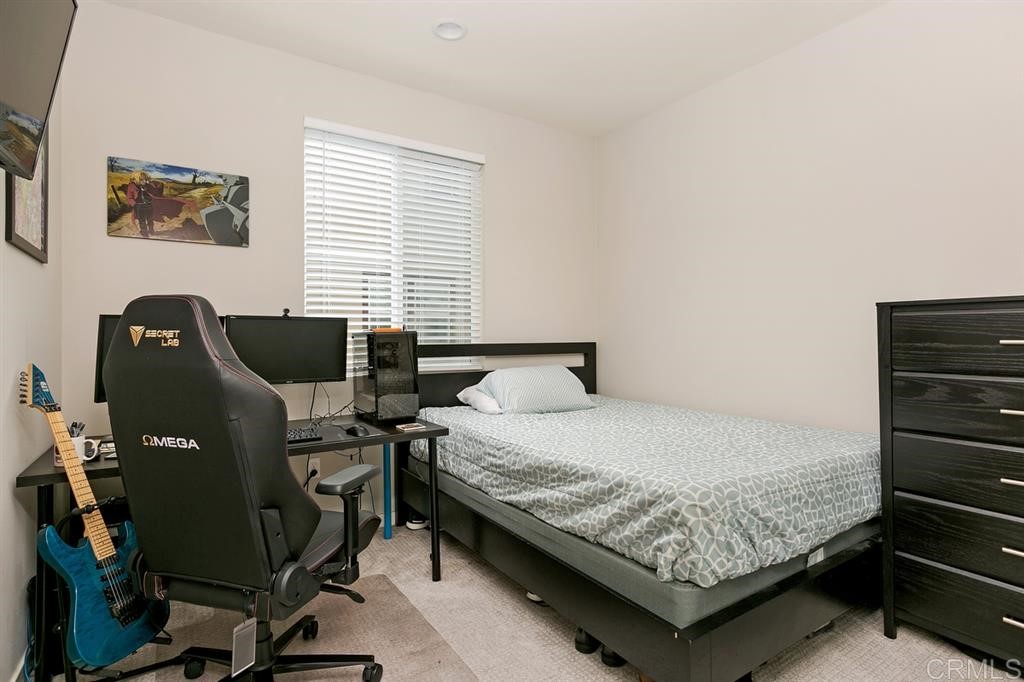 4222 Mission Ranch Way Oceanside, CA 92057 - Photo 12 of 22 a bedroom with a bed and windows