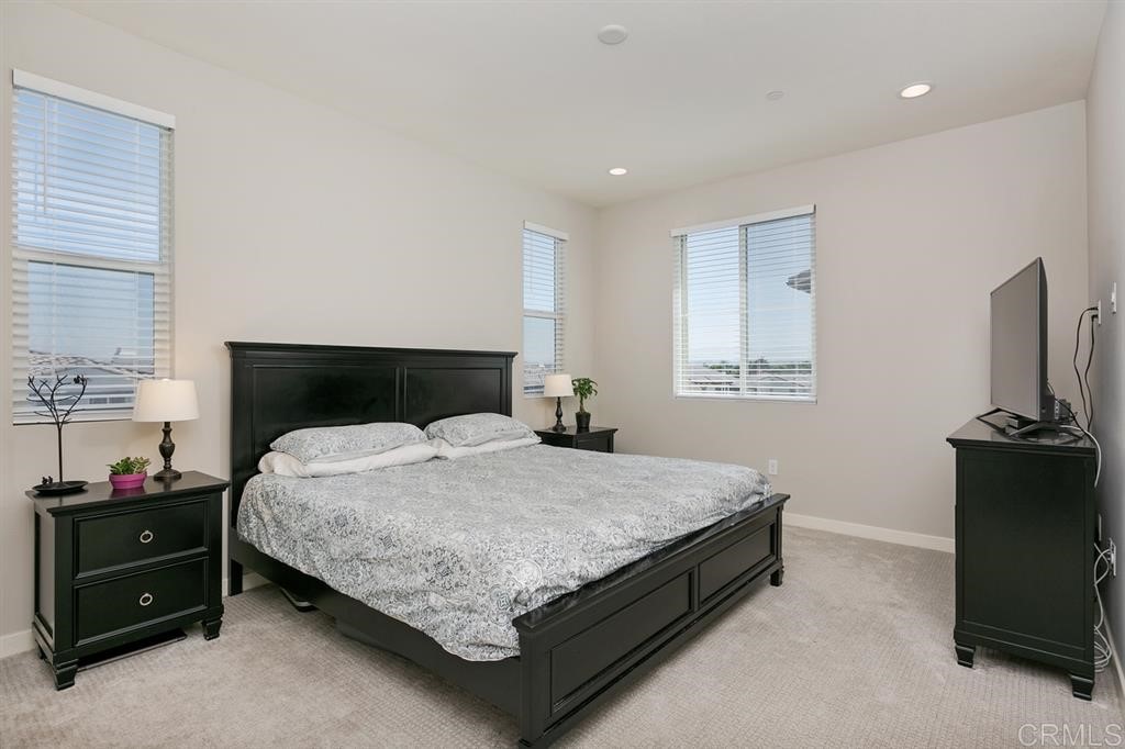 4222 Mission Ranch Way Oceanside, CA 92057 - Photo 15 of 22 a bedroom with a bed and a tv