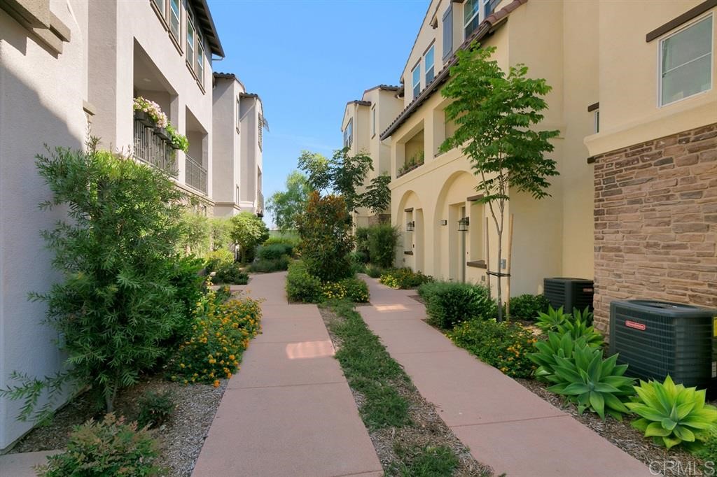 4222 Mission Ranch Way Oceanside, CA 92057 - Photo 2 of 22 a view of a pathway with house on both side