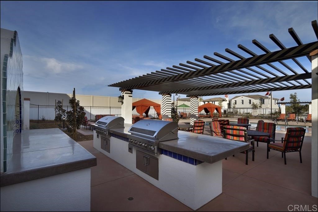 4222 Mission Ranch Way Oceanside, CA 92057 - Photo 22 of 22 a view of a chairs and table in a patio