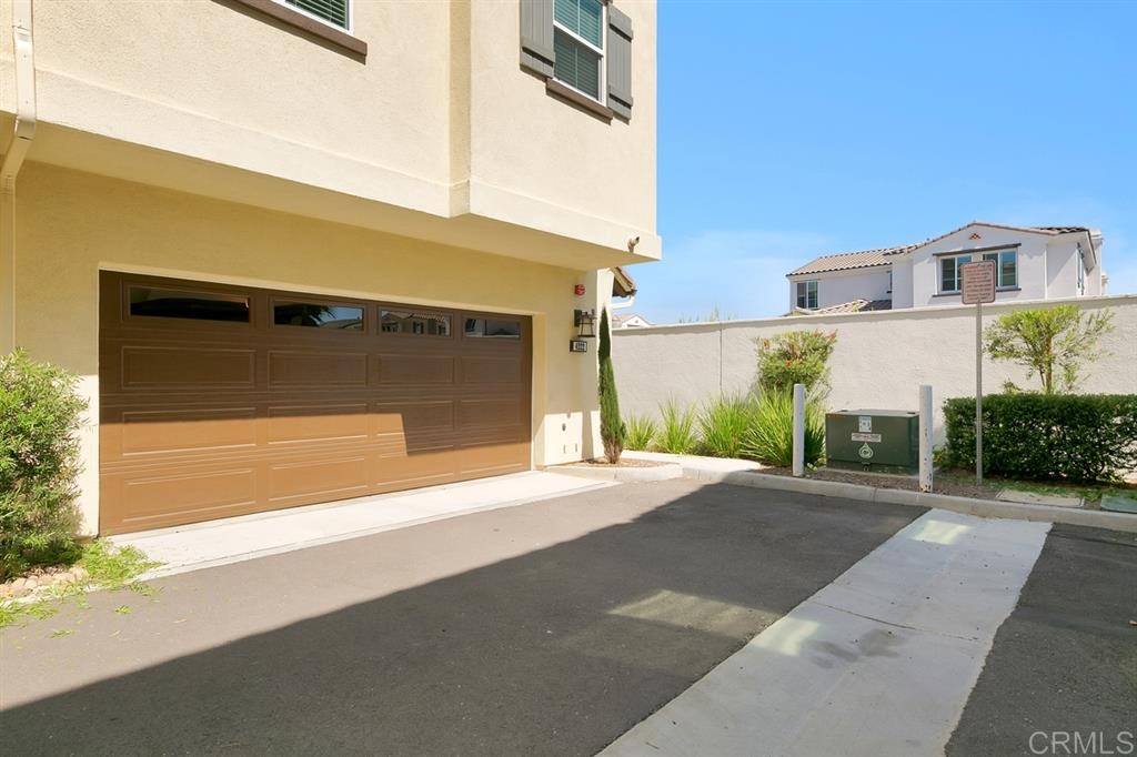 4222 Mission Ranch Way Oceanside, CA 92057 - Photo 4 of 22 a front view of a house with a yard and garage