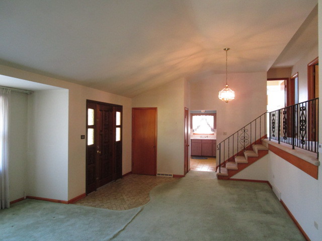 18542 Bock Road Lansing, IL 60438 - Photo 2 of 30 a view of an entryway with stairs