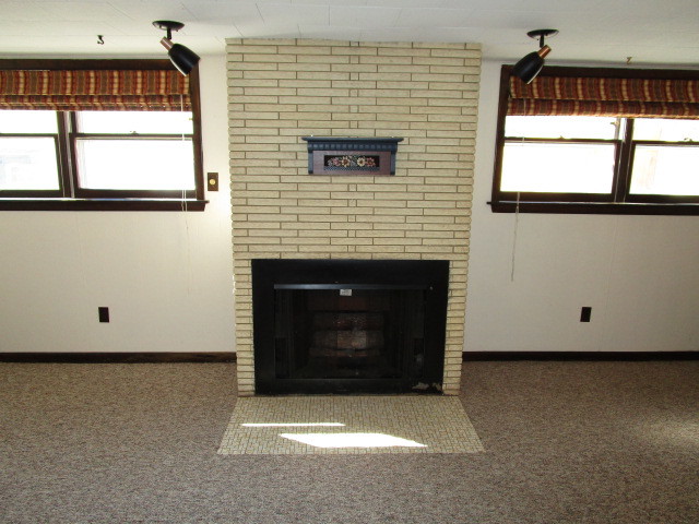 18542 Bock Road Lansing, IL 60438 - Photo 18 of 30 a view of an empty room with a fireplace