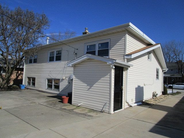 18542 Bock Road Lansing, IL 60438 - Photo 27 of 30 a view of a house with a patio