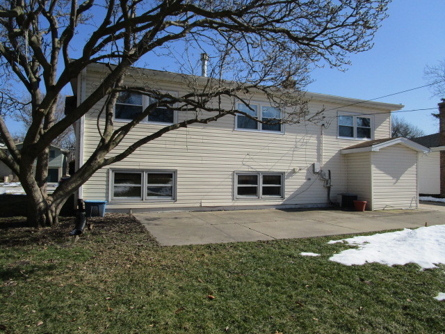 18542 Bock Road Lansing, IL 60438 - Photo 28 of 30 a house that has a tree in front of it