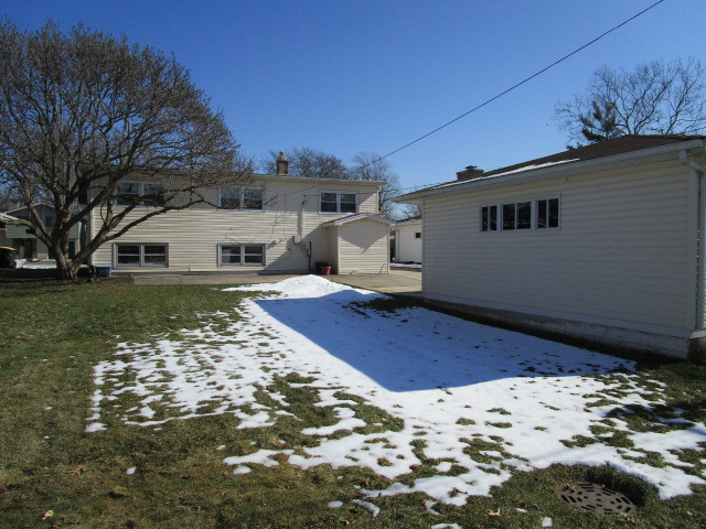 18542 Bock Road Lansing, IL 60438 - Photo 30 of 30 a view of a house with a snow in the yard
