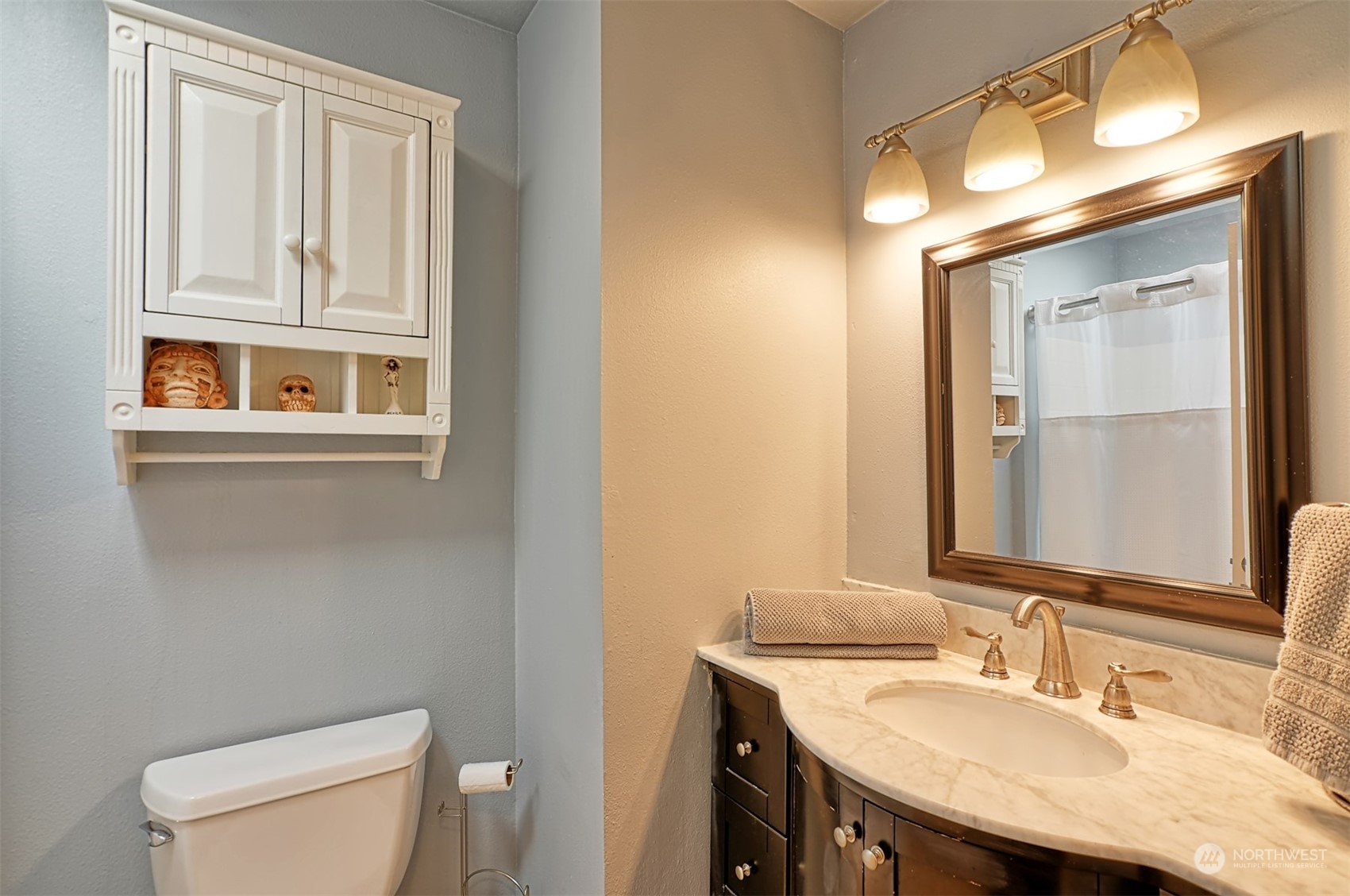 13438 Boulder Ridge Road Southeast Monroe, WA 98272 - Photo 17 of 30 a bathroom with a sink a toilet and mirror