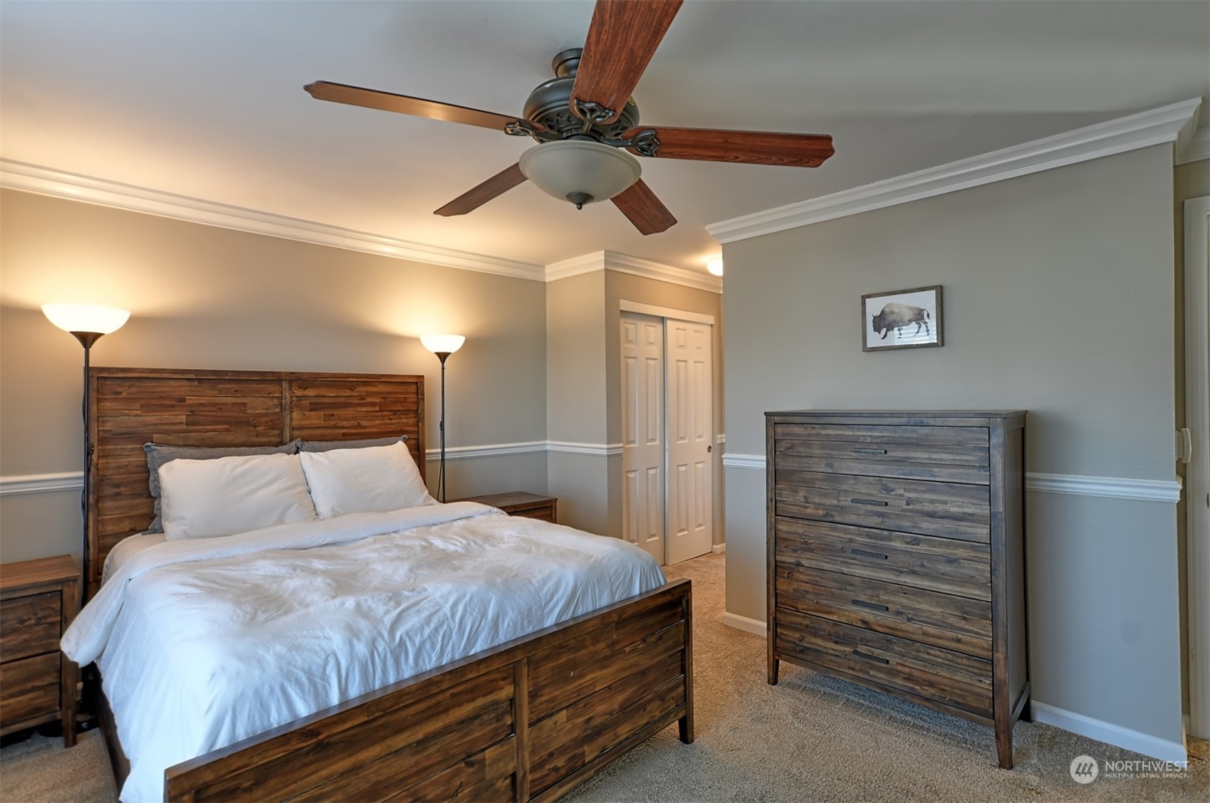 13438 Boulder Ridge Road Southeast Monroe, WA 98272 - Photo 18 of 30 a bedroom with a bed and a ceiling fan