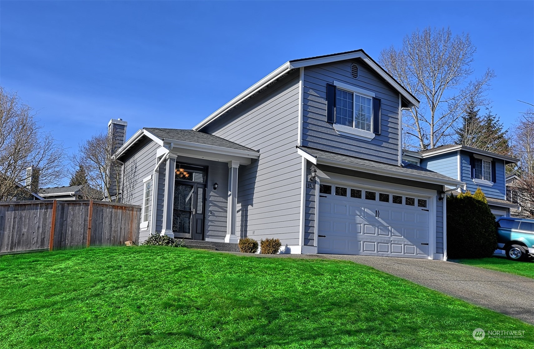 13438 Boulder Ridge Road Southeast Monroe, WA 98272 - Photo 2 of 30 a front view of a house with garden