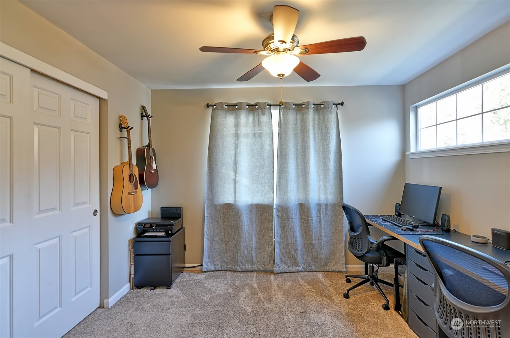 13438 Boulder Ridge Road Southeast Monroe, WA 98272 - Photo 25 of 30 a view of a workspace with furniture and a window