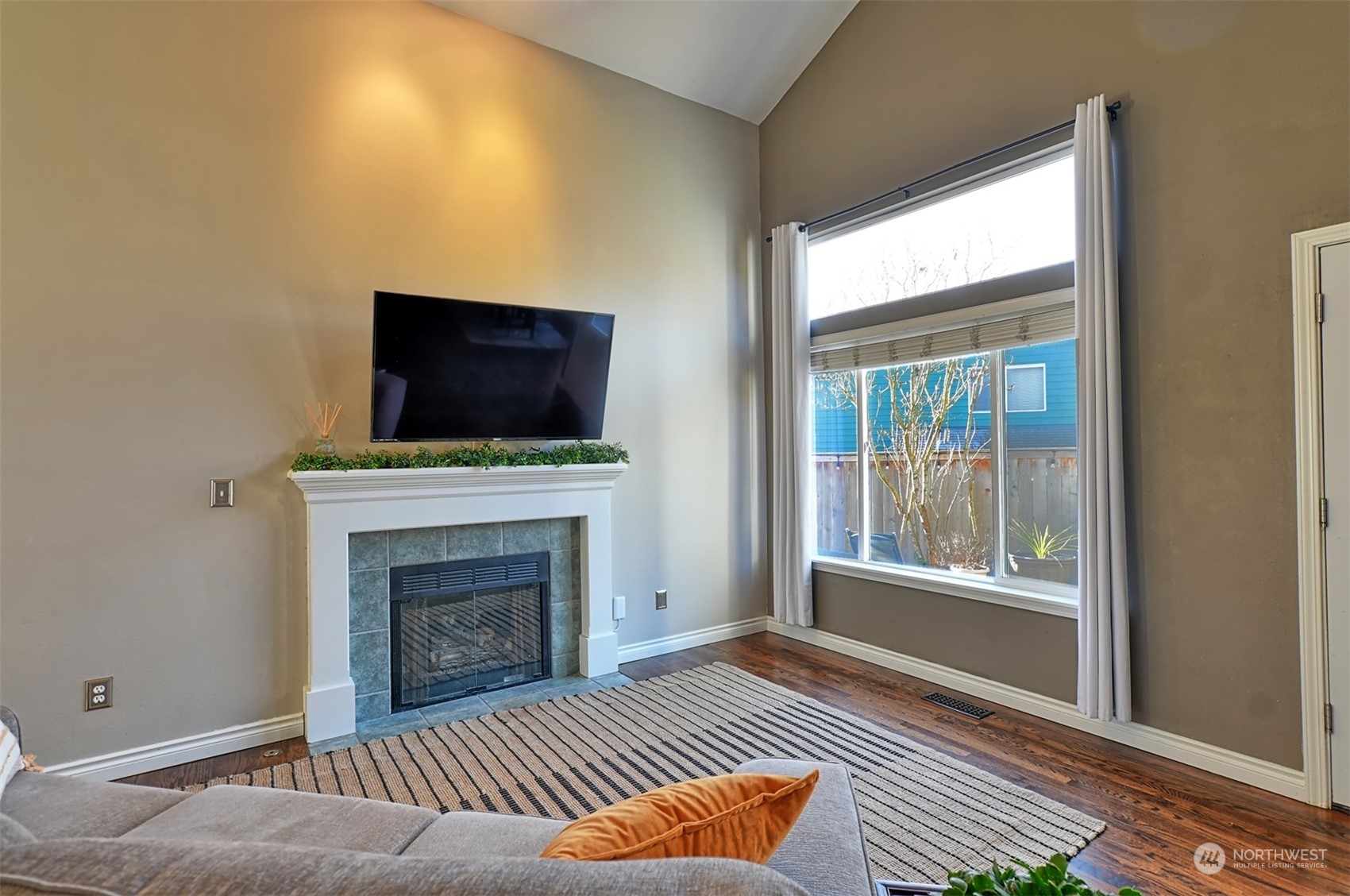 13438 Boulder Ridge Road Southeast Monroe, WA 98272 - Photo 5 of 30 a living room with furniture and a fireplace